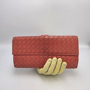 This is a Bottega Veneta Intrecciato Leather Long Wallet In Coral